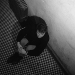 Who’s That Knocking At My Door (1967) | Martin Scorsese production design | Martin Scorsese Films | Harvey Keitel sits on tiny checkered floor against white wall beside vent